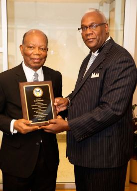 Medgar Evers hails retired geography professor