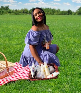 Guyanese Corenza Handy displays her own haircare line.