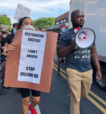 Josue Pierre leading protest at Black Lives Matter Rally.   Vladimir Sterlin