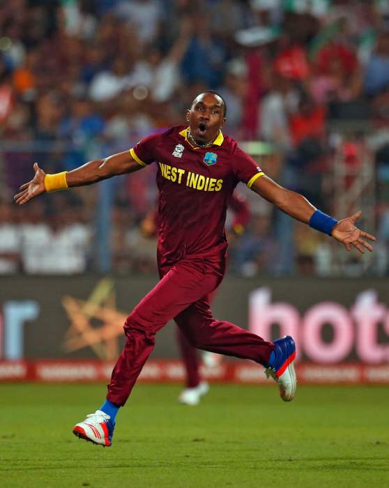 West Indies Dwayne Bravo celebrates taking the wicket of England's Moeen Ali. Bravo also plays for the Trinbago Knight Riders.