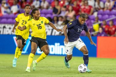 Costa Rica on the attack against the Reggae Boyz.  CONCACAF/ Edgar Quintana