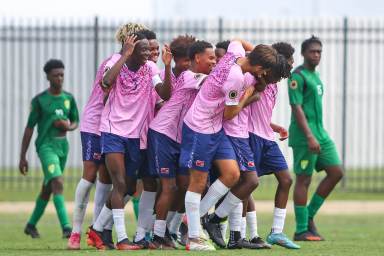 Bermuda celebrates one of its four goals in the match against the British Virgin Islands.