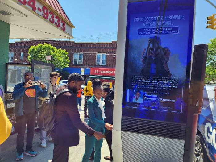 Assemblywoman Chandler-Waterman and NYC Public Advocate Jumaane Williams test the LinkNYC 988 crisis line.