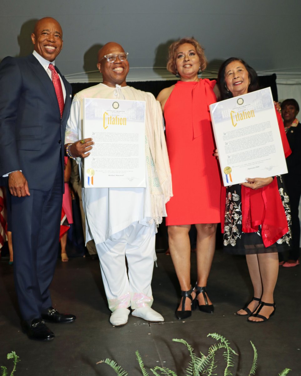 Mayor Eric Adams, left, presented proclamations to Michael Manswell and Patricia Chin. Hazra Ali, third from left.