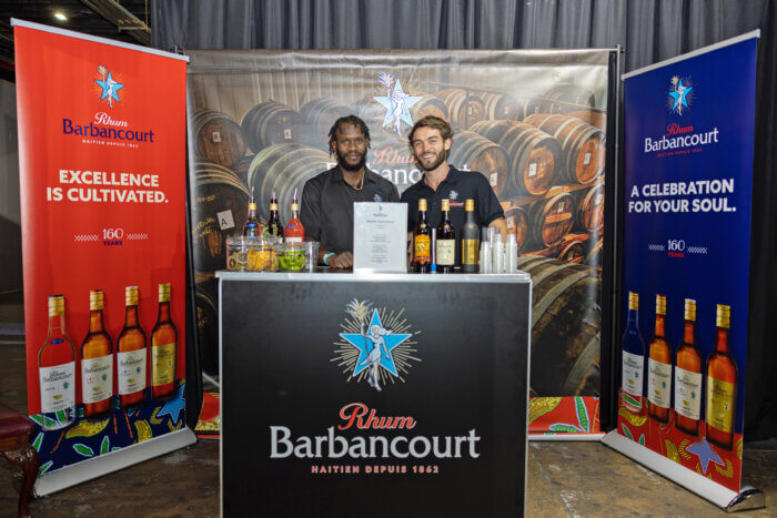 Representatives of Rhum Barbancourt with their wide variety of rum products.