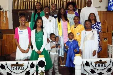 Graduates with Pastor Roger Jackson (back row far right).