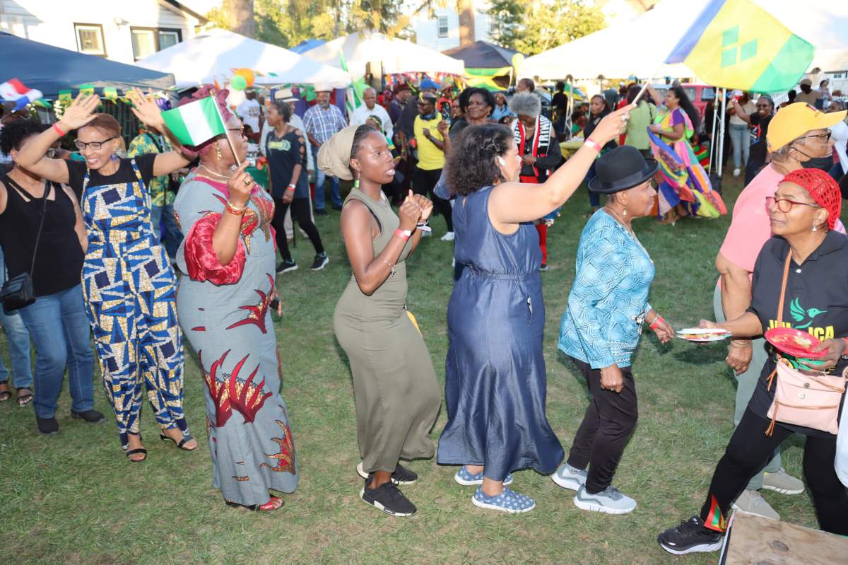 Nationals join the Congo Line, dancing to "Soca Train.”