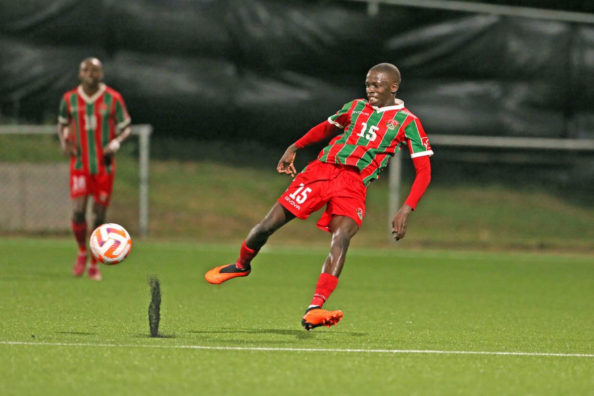 BASSETERRE, ST. KITTS & NEVIS. AUG. 4: Renske Adipi #15 of Robinhood drives the ball during the group a match between 0&M FC and Robinhood in the Concacaf Caribbean Club Shield, held at the SKNFA Tecchnical Centre stadium, in Basseterre, St Kitts & Nevis.