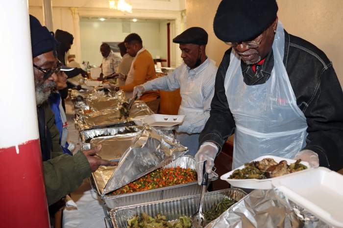 Officials of the Executive Committee of Grand Council share Thanksgiving meal.