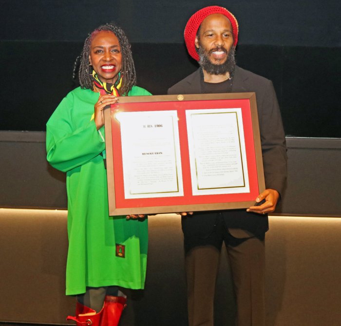 Brooklyn's Congresswoman Yvette D. Clarke presents a copy of the resolution to Ziggy Marley in Washington DC at a special screening of the “Bob Marley One Love Biopic.”