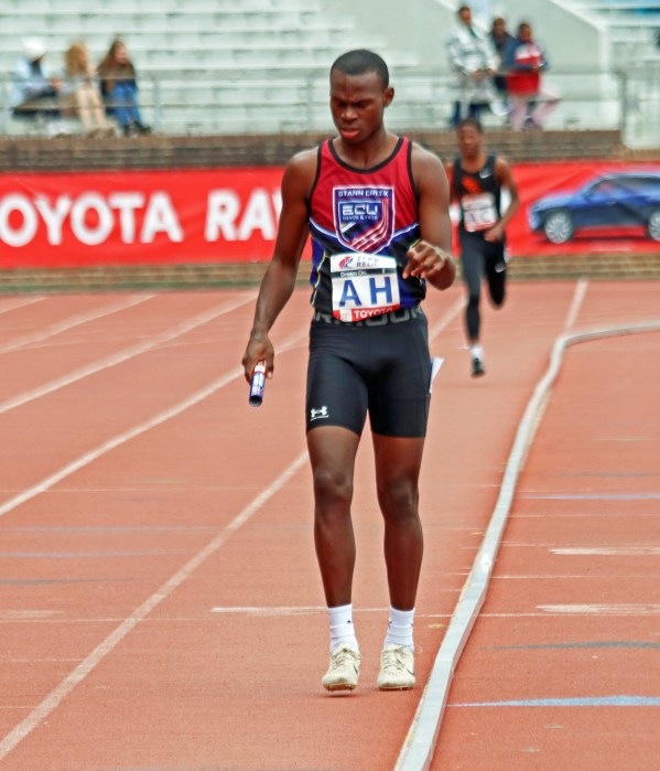 Belizean athlete, with AH tag, at end of 4x400m heat, enabling his team to earn first medal (silver) at Penn Relays.
