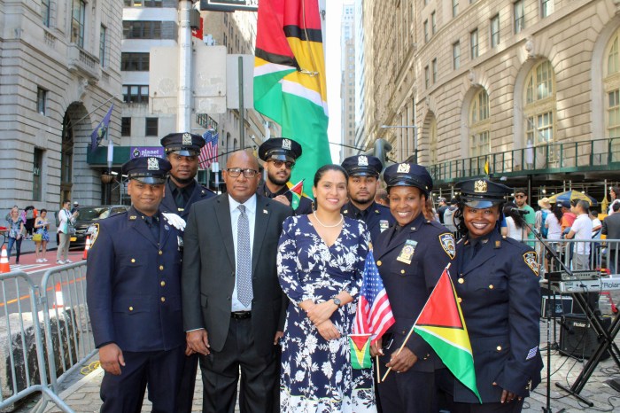 Consul General Michael E. Brotherson, second from left, next to Ambassador Trishala Persaud, surrounded by NYPD GALEA fraternity, during Guyana's 58th Independence Anniversary at Bowling Green square in NYC on May 24.