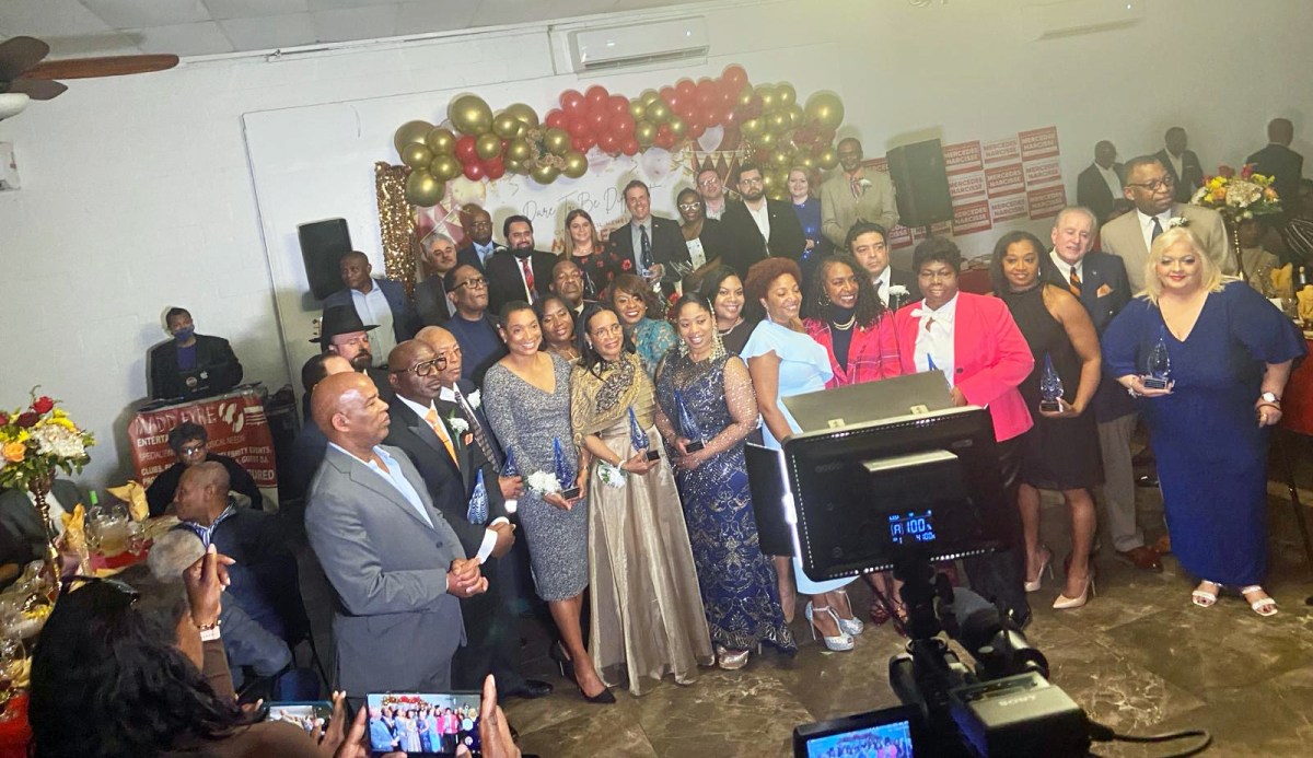 Narcisse, center, with honorees and patrons.