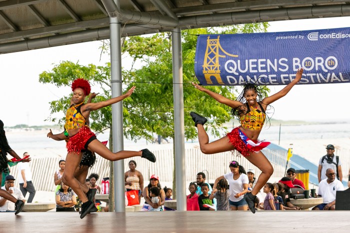 Two female dancers of the CarNYval Dancers perform during the 2023 Queensboro Dance Festival.