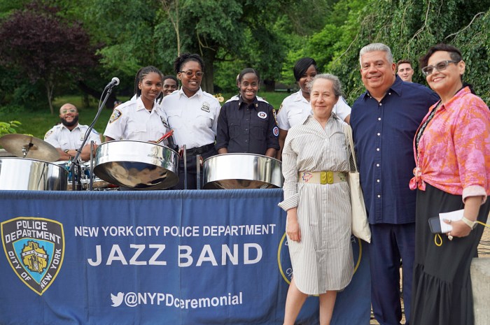 Bishop Cecil Riley, Freedom Hall Church of God, Marica Currasco, VP Public Alliance, Prospect Park Alliance and Brooklyn DA, Eric Gonzalez pose with NYPD Steelpan Band and other officials.
