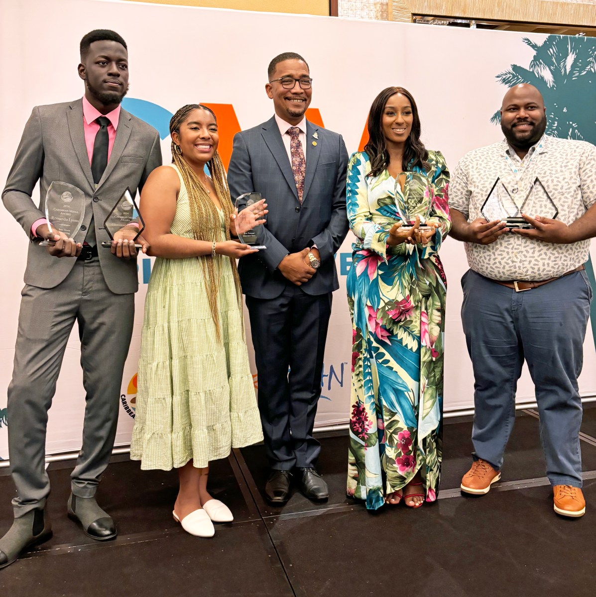 Caribbean Media Awards: From left, Romardo Lyons from TVJ Jamaica, Kaitlyn McNab, Teen Vogue, Kenneth Bryan, minister for Tourism & Ports of the Cayman Islands, Melissa Noel, ESSENCE and Brent Pinheiro of the Trinidad Guardian.