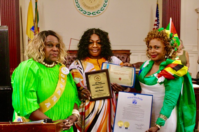From left, Lady Ira Lewis, award recipient, Doris Rodney, proprietor of the Brooklyn Hills Restaurant, and Monica Sanchez, at Guyana's 58th Independence Awards and flag raising at East Orange City Hall, NJ on June 14.