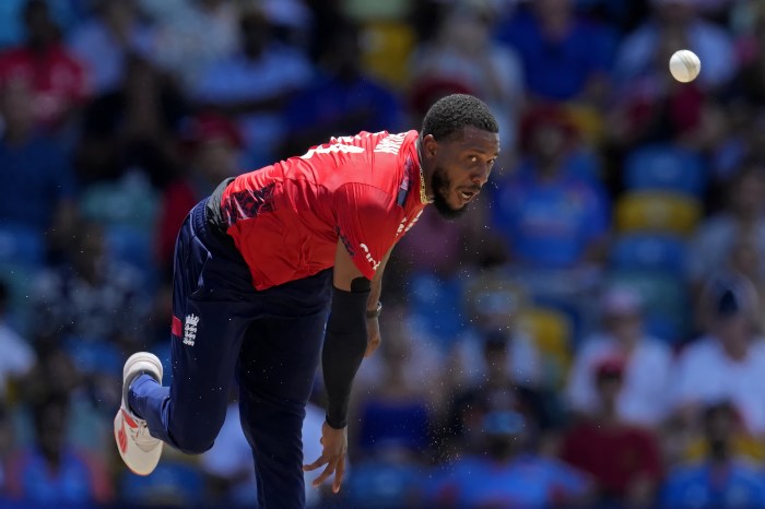 England's Chris Jordan bowls the delivery to get a hat-trick by dismissing the United States' Saurabh Nethralvakar during the ICC Men's T20 World Cup cricket match between the United States and England at the Kensington Oval in Bridgetown, Barbados, Sunday, June 23, 2024.