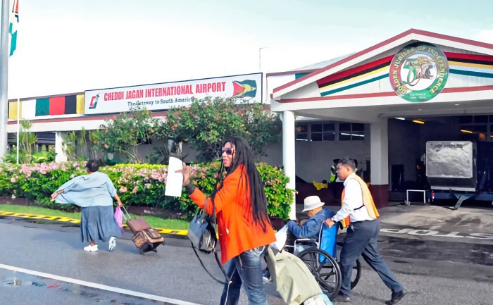 assengers arriving at Cheddi Jagan International Airport in Guyana.