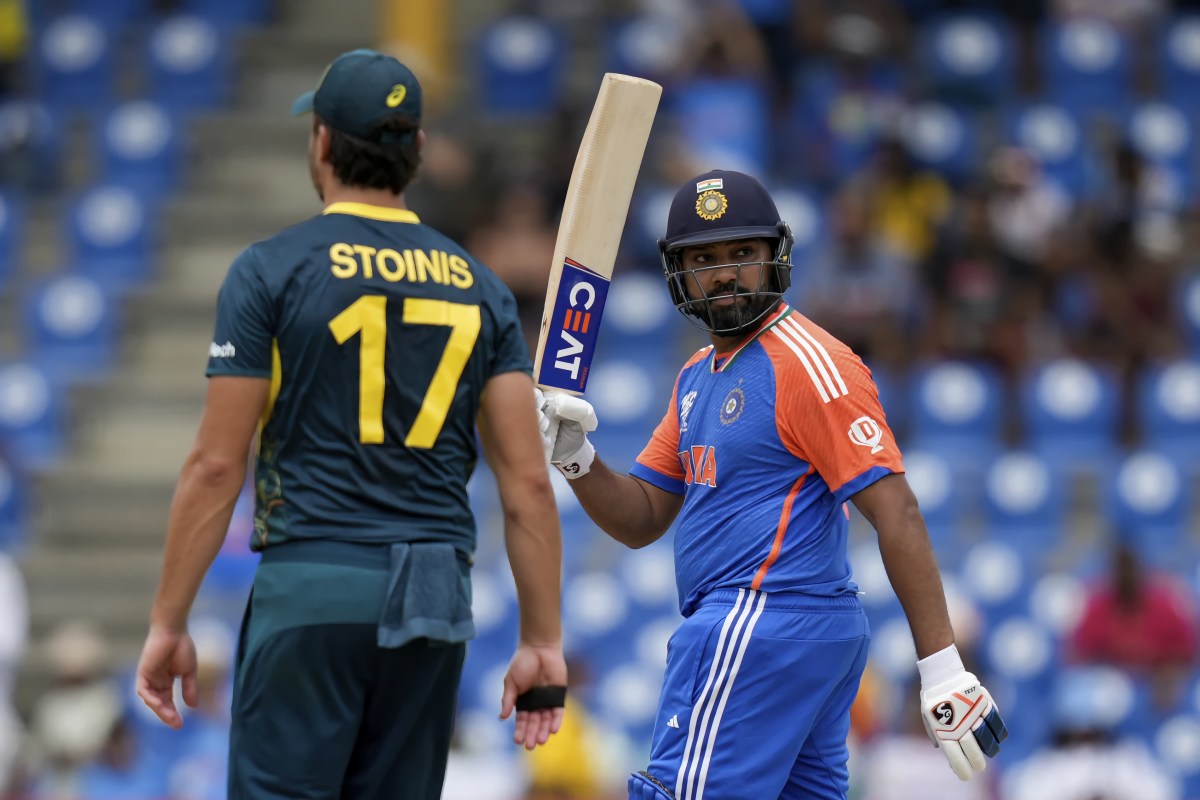 India's captain Rohit Sharma celebrates after scoring 50 runs during an ICC T20 World Cup cricket match at the Darren Sammy National Cricket Stadium in Gros Islet, Saint Lucia, Monday, June 24, 2024.