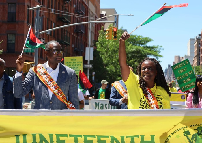 New York State Senator, Cordell Cleare and City Council Member, Yusef Salaam lead the parade for Masjib Malcolm Shabazz’s 31st annual Juneteenth celebration in Harlem on Saturday, June 15.