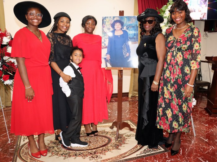 Vanda Karlyn-Dale Collis-Collins (fifth from left), the only child of Lystra Collis with immediate family members during the viewing at Caribe Funeral Home.