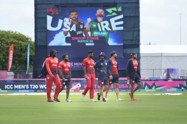 Team United States' cricketers walk in to field before an ICC World Cup T20 cricket match between the United States and Ireland at the Central Broward regional Park Stadium, Fort Lauderhill, Florida, June 14, 2024.