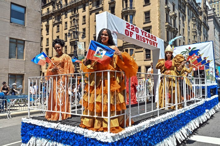 Haitians parade on a float during the second Haitian Day Parade NYC in Manhattan.