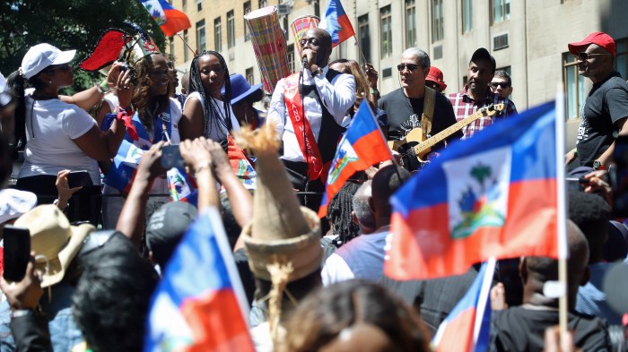 Wyclef Jean performing at the Annual Haitian Day Parade with elected officials, advocates and members of the community.