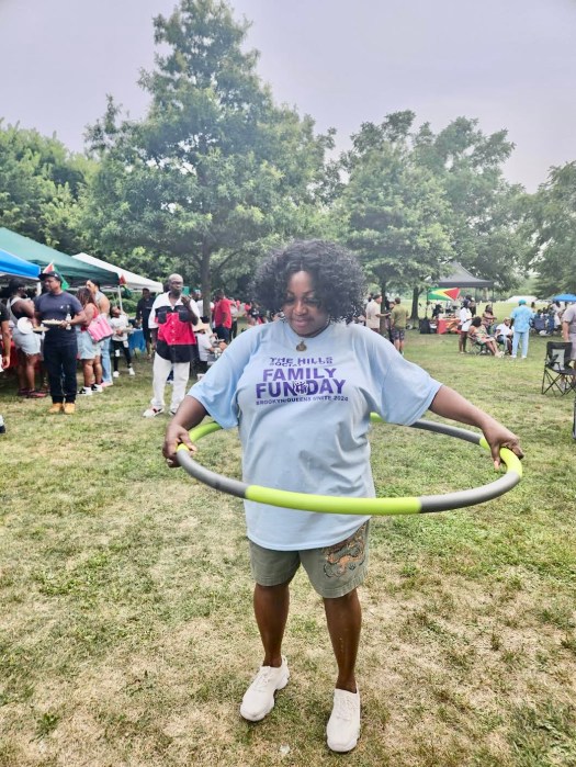 Doris Rodney, founder of the Hills Social Club entertains picnickers with a Hulu Hoop demonstration at the very first Brooklyn/Queens Linkup Family day on July 28, in Canarsie Park on Seaview Avenue
