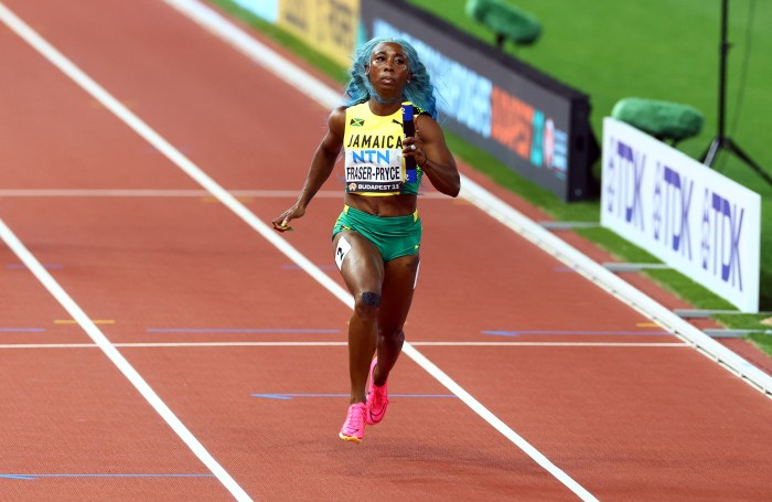 Athletics - World Athletics Championship - Women's 4x100m Relay Heats - National Athletics Centre, Budapest, Hungary - August 25, 2023 Jamaica's Shelly-Ann Fraser-Pryce on her way to win heat 1 
