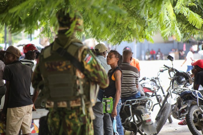 A Kenyan police officer stands guard during a joint operation with Haitian police, in Port-au-Prince, Haiti July 29, 2024.