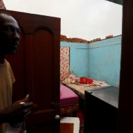 Collins Stephenson stands inside his home where the roof was ripped apart, in the aftermath of Hurricane Beryl, in St. Elizabeth Parish, Jamaica, July 5, 2024.