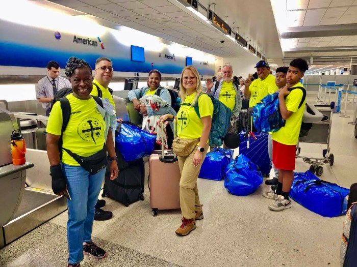 Guyanese-born president and founder of Backpack International, Oslyn Rodriguez, third from left, with a team of volunteers on their way to the hinterlands of Guyana, to distribute school supplies, and conduct a summer camp until July 15.