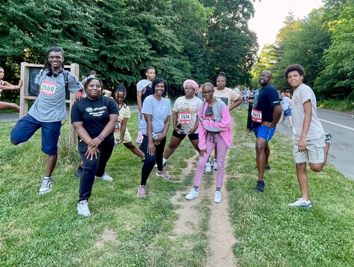 Having a silly moment and stretching before the Run So They Can Fly 5K in Prospect Park on Juneteenth.