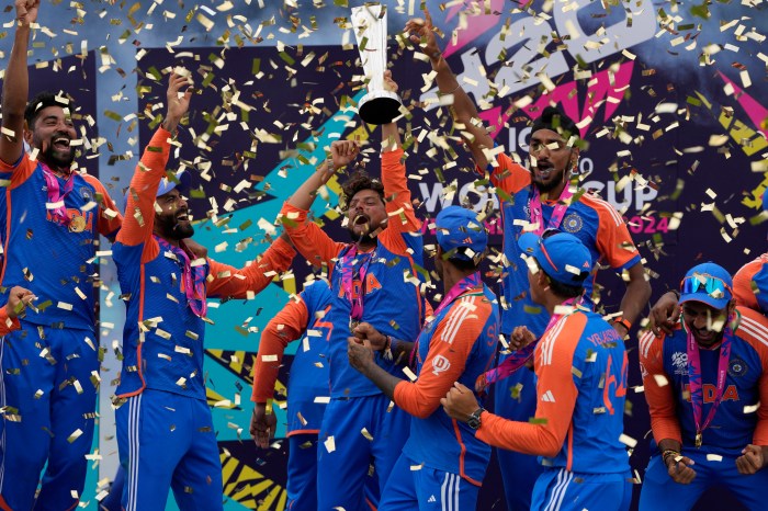 Indian players celebrate with the winners trophy after defeating South Africa in the ICC Men's T20 World Cup final cricket match at Kensington Oval in Bridgetown, Barbados, Saturday, June 29, 2024.