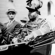 Marcus Garvey is shown in a military uniform as the Provisional President of Africa during a parade up Lenox Avenue in Harlem, New York City, Aug. 1922 during opening day exercises of the annual Convention of the Negro Peoples of the World.