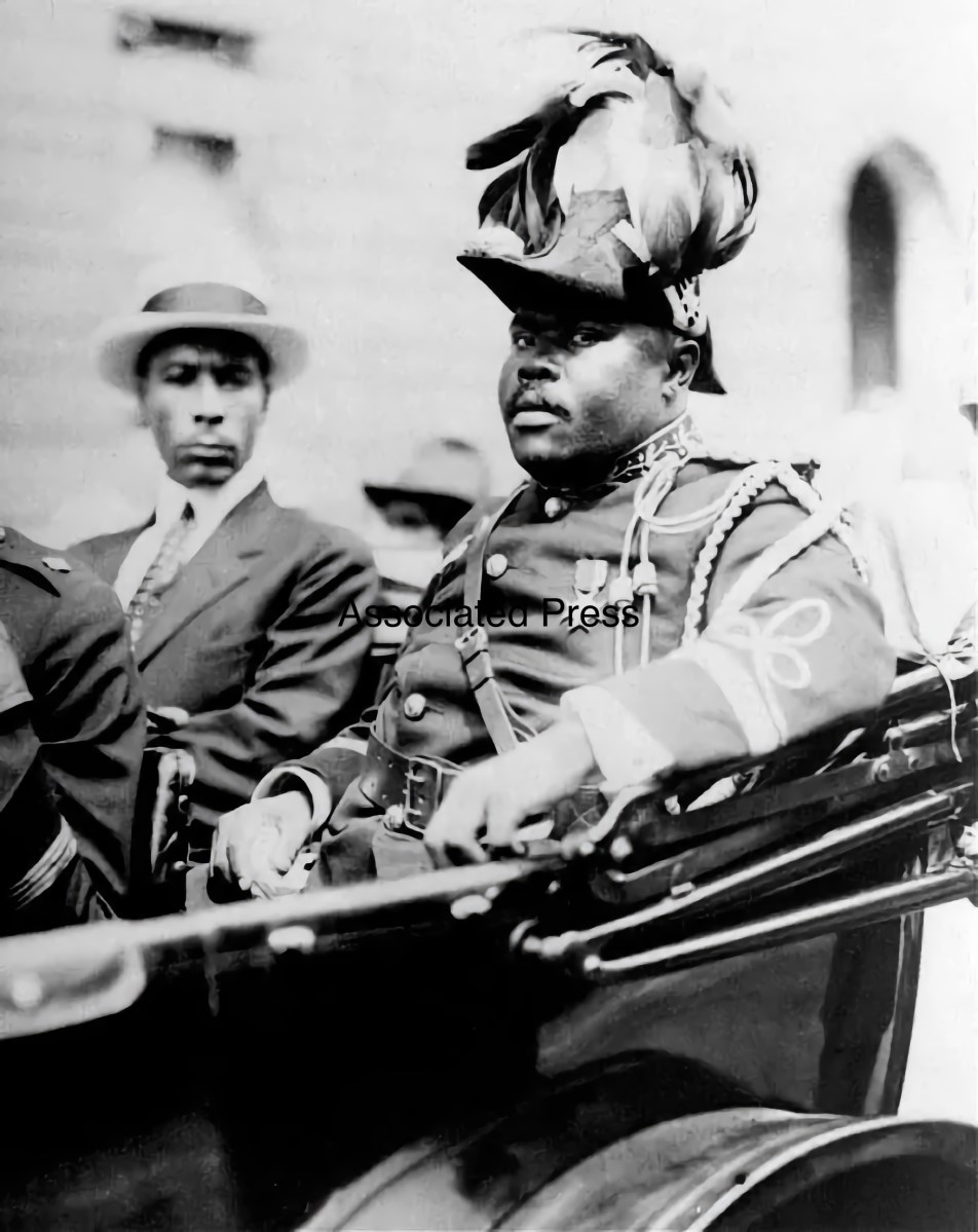 Marcus Garvey is shown in a military uniform as the Provisional President of Africa during a parade up Lenox Avenue in Harlem, New York City, Aug. 1922 during opening day exercises of the annual Convention of the Negro Peoples of the World.