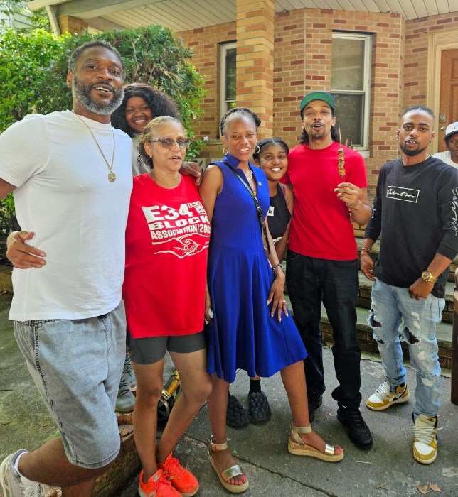 From left, a resident of E 34th Street, President of the Block Association, Guyanese-born June Persaud, and Assemblywoman Monique Chandler-Waterman, enjoy BBQ and music during the return of the community's Annual Block Party, on July 13, after a hiatus due to the coronavirus pandemic.