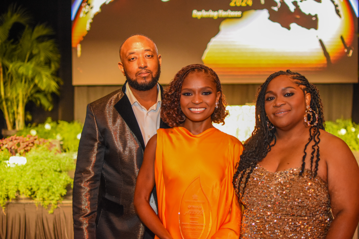  Dominique Thorne shares a celebratory moment with her parents, Carnarvon Guy, and mother, Nerissa Guy, during the National  Entrepreneurship Awards at the Hyatt Regency in Trinidad and Tobago.