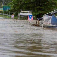 A bridge submerged by the flooded La Plata River is seen in the aftermath of Tropical Storm Ernesto, in Toa Baja, Puerto Rico August 14, 2024.