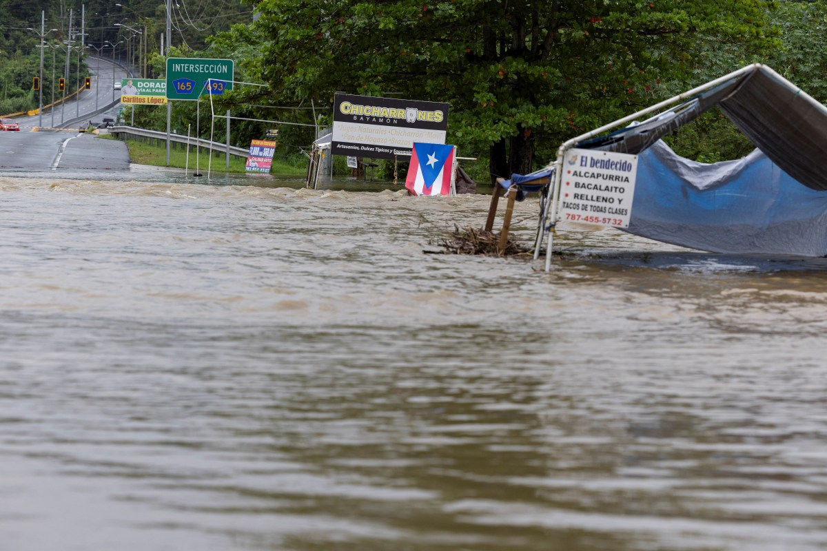 A bridge submerged by the flooded La Plata River is seen in the aftermath of Tropical Storm Ernesto, in Toa Baja, Puerto Rico August 14, 2024.