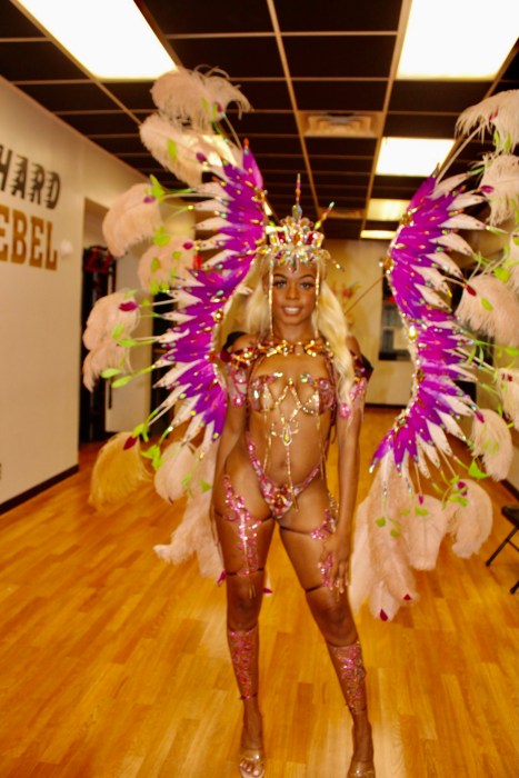 Top costume model Lala Rosayy displays dazzling costume from the section, Gluttony, one of the Seven Deadly Sins, from Suga Candy Mas costume band ready to revel on Eastern Parkway, at the 57th West Indian American Carnival parade, on Sept. 2.