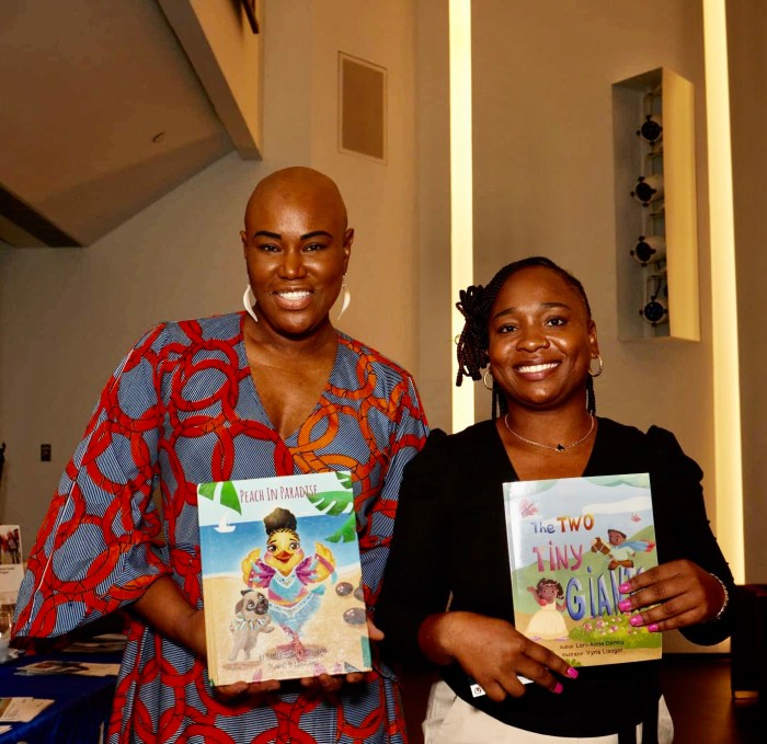 Author Kamla Millsood,left, daughter of late Caribbean Life editor-in-chief Kenton K. Kirby, holding a volume from Peach the Duck series. Lori-Anne Danielle, showcases, "The Two Tiny Giants" the first book produced  by Palatial Publishing LLC. 