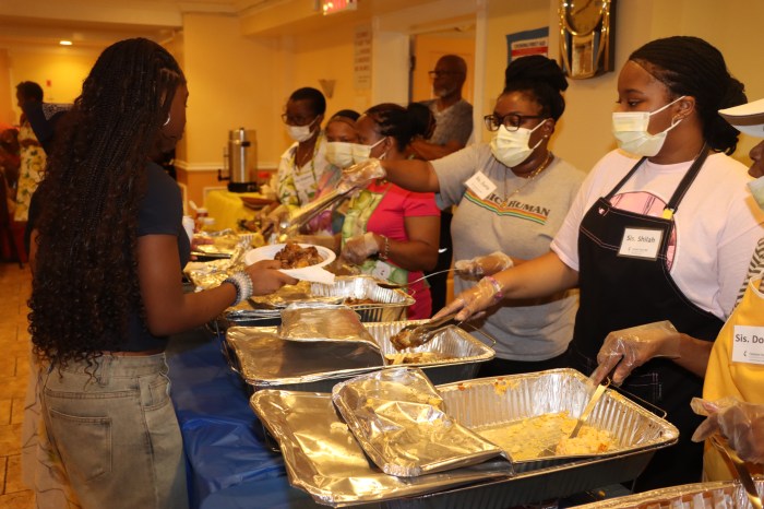 Youths serving lunch to homeless families.