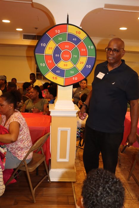 Pastor Roger Jackson prepares Dart game