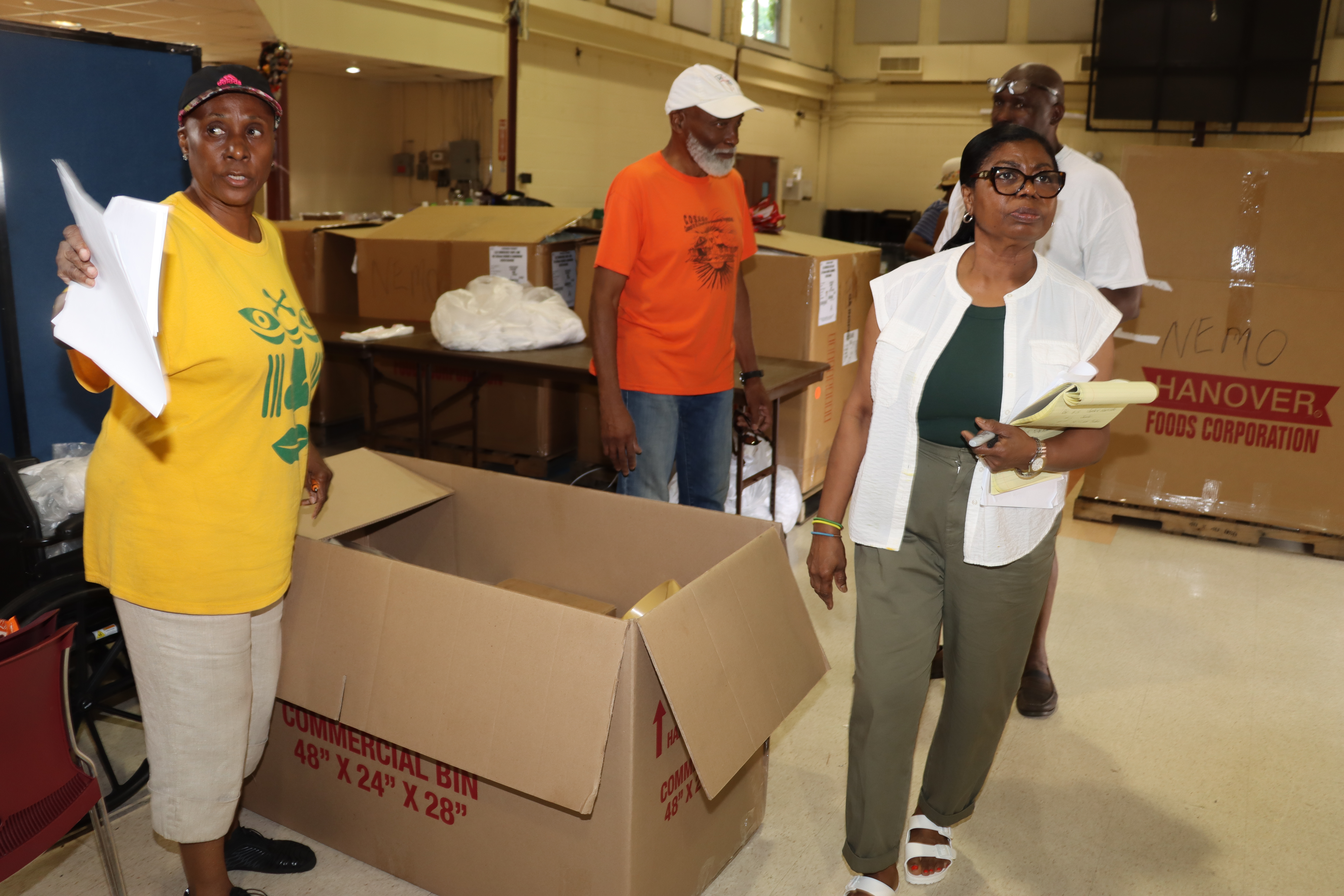 Verna Arthur, left, and Laverne McDowald-Thompson direct and take inventory of supplies to be shipped to St. Vincent and the Grenadines