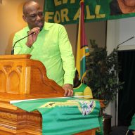 Rickford Burke, president of the Brooklyn-based Caribbean Guyana Institute for Democracy (CGID), addresses hundreds of Guyanese at a rally in Brooklyn in early 2020