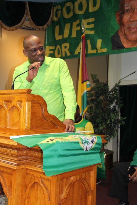 Rickford Burke, president of the Brooklyn-based Caribbean Guyana Institute for Democracy (CGID), addresses hundreds of Guyanese at a rally in Brooklyn in early 2020