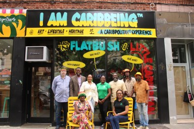 Saint Lucia Export executives had an hours-long sit down at the I Am Caribbeing Store at 1399 Nostrand Avenue in Brooklyn's Little Caribbean. From left,standing, MacDonald Romain, Consul General of St. Lucia to New York, Jeremiah Hyacinth, Sunshine Foss, Brooklyn Buds/Cork, Senior Client Manager Fercinta Louisy, Export Saint Lucia, Mike Nicholas, Aunts & Uncles, Kigan Joseph, Mixologist, and Janluk Stanilas. Sitting from left, is Shelly Worrell, founder of I Am Caribbeing, and Chief Executive Officer, Sunita Daniel, Export Saint Lucia, outside of the Little Caribbean store.